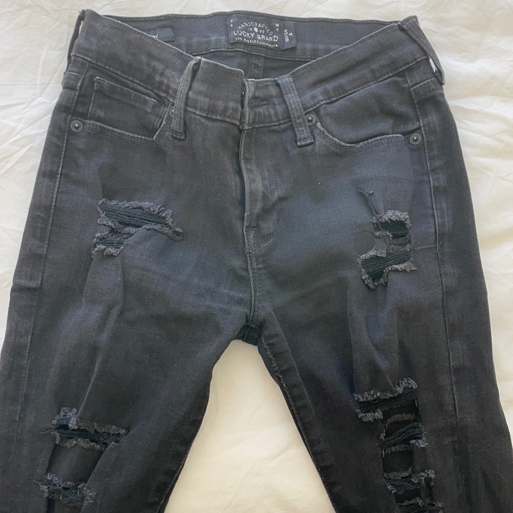 Lucky Brand ripped black jeans in size 00/24